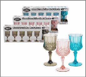 Set of colorful glass goblets with packaging on a white background