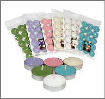 Assorted colored tea light candles in packaging on a white background