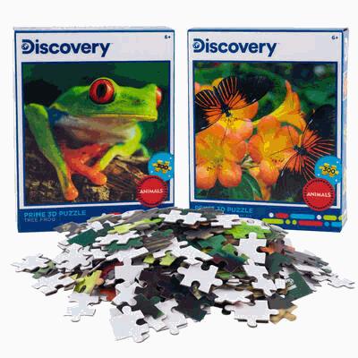 Two Discovery brand animal-themed puzzles with puzzle pieces in front.