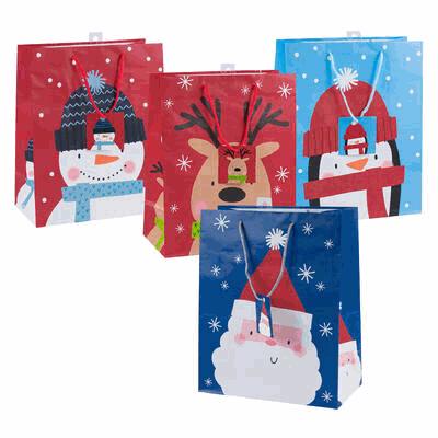 Set of four Christmas-themed gift bags with snowman, reindeer, penguin, and Santa Claus designs.