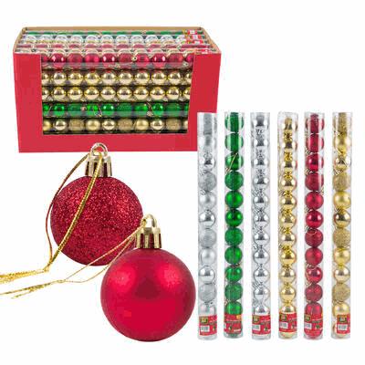 Red and gold Christmas ornaments with packaging on a white background