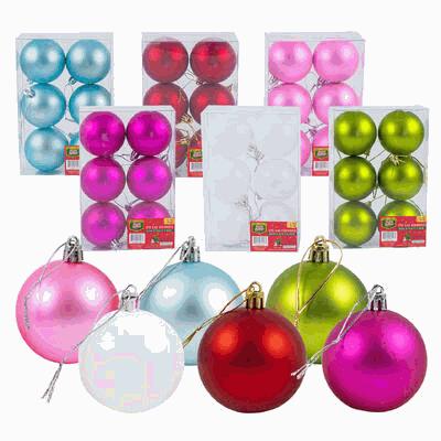 Assorted colorful Christmas ball ornaments in packaging on a white background