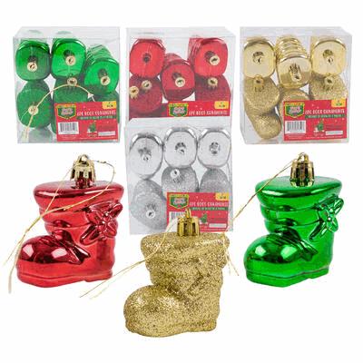 Set of Christmas boot ornaments in red, gold, and green with packaging in the background.