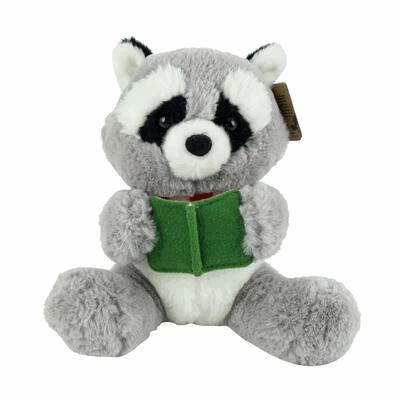 Plush raccoon toy holding a green book on a white background