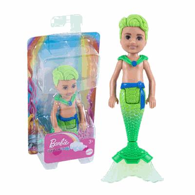 Mermaid doll with green hair and tail next to its packaging on a white background