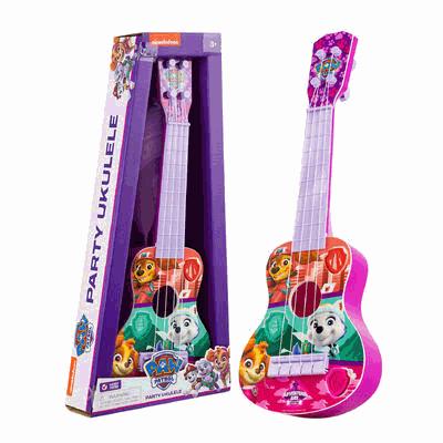 Toy ukulele with Paw Patrol design next to its packaging on a white background