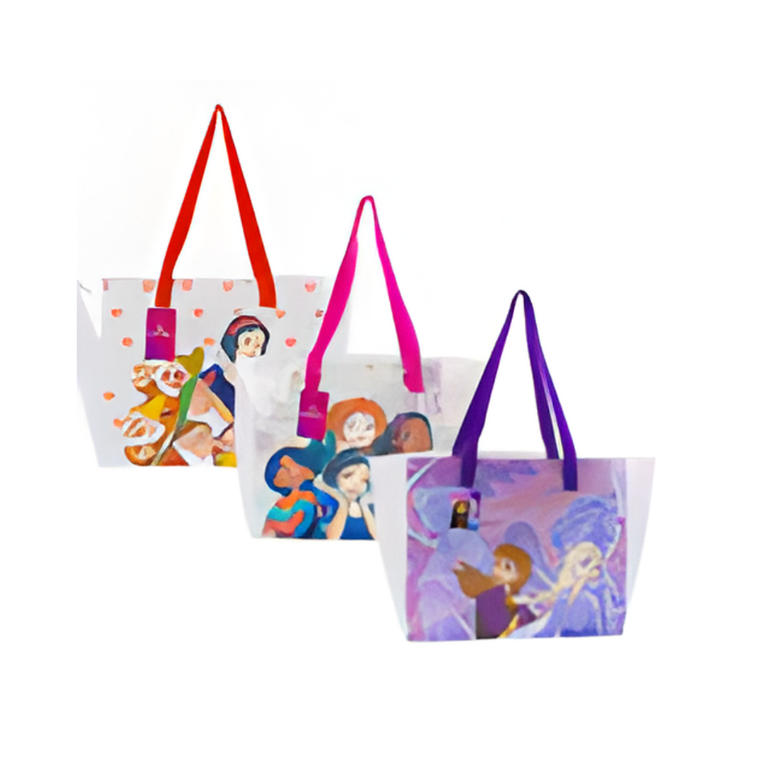 Three colorful tote bags with character designs on a white background